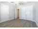Bedroom featuring hard floors, ceiling fan, and large double-door closet at 16 Franklin S Ct # A, St Petersburg, FL 33711