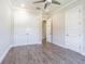 Large bedroom featuring a ceiling fan, hard floors, and closet at 16 Franklin S Ct # A, St Petersburg, FL 33711