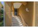 An exterior view of a home's front entrance showcasing the front door and steps at 16 Franklin S Ct # A, St Petersburg, FL 33711