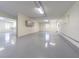 An expansive garage with epoxy flooring, offering ample space and potential for various uses at 16 Franklin S Ct # A, St Petersburg, FL 33711