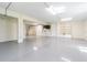 This is a large garage with a sink, bright lighting, and a clean epoxy floor at 16 Franklin S Ct # A, St Petersburg, FL 33711