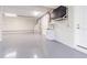 A bright and spacious garage featuring an epoxy floor, sink, and additional storage options at 16 Franklin S Ct # A, St Petersburg, FL 33711