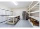 This garage features cabinets, a workbench, and a refrigerator, offering ample storage and workspace at 16 Franklin S Ct # A, St Petersburg, FL 33711