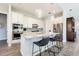 Modern kitchen with white cabinets, stainless steel appliances, and a spacious center island at 16 Franklin S Ct # A, St Petersburg, FL 33711