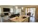 Open-concept kitchen with granite countertops, stainless appliances, and a view to the connected living area and outdoor space at 16 Franklin S Ct # A, St Petersburg, FL 33711