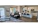 Bright living room featuring a view into a kitchen with a central island with stool seating at 16 Franklin S Ct # A, St Petersburg, FL 33711