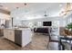 Spacious living room with open floor plan and modern decor, flowing into the kitchen at 16 Franklin S Ct # A, St Petersburg, FL 33711