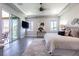 A serene bedroom suite featuring a tray ceiling, balcony access, and ample natural light at 16 Franklin S Ct # A, St Petersburg, FL 33711