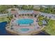 Stunning aerial view of pool with sunbathers and inviting, oversized spa at 16 Franklin S Ct # A, St Petersburg, FL 33711