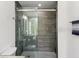 Modern shower with glass doors and contemporary gray tile at 170 E Davis Blvd, Tampa, FL 33606