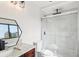 Modern bathroom with marble tile, a glass-enclosed shower, and sleek fixtures at 170 E Davis Blvd, Tampa, FL 33606