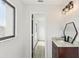 Bathroom featuring vanity with a granite countertop and decorative lighting at 170 E Davis Blvd, Tampa, FL 33606