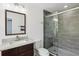 Well-lit bathroom featuring a glass shower, modern fixtures, and vanity with lots of counter space at 170 E Davis Blvd, Tampa, FL 33606