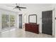 Bedroom featuring luxury vinyl flooring, private balcony and stylish decor at 170 E Davis Blvd, Tampa, FL 33606