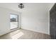 Empty bedroom with luxury vinyl flooring and a bright window at 170 E Davis Blvd, Tampa, FL 33606
