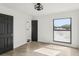 Bedroom featuring wood-look tile flooring, closet, and access to the bathroom at 170 E Davis Blvd, Tampa, FL 33606
