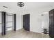 Bedroom with hardwood floors, closet organizer, and attached bathroom at 170 E Davis Blvd, Tampa, FL 33606