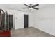 Spacious bedroom with luxury vinyl flooring and a ceiling fan at 170 E Davis Blvd, Tampa, FL 33606