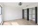 Bedroom features wood-look tile flooring, closet, and a modern ceiling light at 170 E Davis Blvd, Tampa, FL 33606