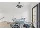 Cozy dining area featuring modern lighting and a glass-top table with seating for four at 170 E Davis Blvd, Tampa, FL 33606