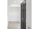 Hallway featuring white walls, wood-look tile flooring, and closet at 170 E Davis Blvd, Tampa, FL 33606