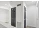 Hallway featuring white walls, wood-look tile flooring, and closet at 170 E Davis Blvd, Tampa, FL 33606