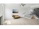 Bright living room with modern finishes, beautiful flooring, and a cozy chaise lounge at 170 E Davis Blvd, Tampa, FL 33606