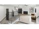 The living room features a fireplace, open staircase, and light, wood-look tile flooring at 170 E Davis Blvd, Tampa, FL 33606