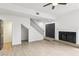 Open living area with a fireplace, staircase, and neutral flooring offering a bright and spacious feel at 170 E Davis Blvd, Tampa, FL 33606