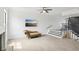 Bright living room featuring stairs, a fireplace, and modern flooring bathed in natural light at 170 E Davis Blvd, Tampa, FL 33606