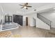 Bright living room with modern tile flooring, stairway, and outdoor access beyond the staircase at 170 E Davis Blvd, Tampa, FL 33606