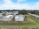 Aerial view showcases the home within the community, with its metal roof contrasting with the surrounding environment at 1710 7Th Sw St # 95, Ruskin, FL 33570