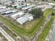 Aerial view showcases the community, the trees and the home with the metal roof, offering a great neighborhood feel at 1710 7Th Sw St # 95, Ruskin, FL 33570