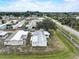The aerial view highlights the mobile home's position within the neighborhood and its proximity to the fenced yard at 1710 7Th Sw St # 95, Ruskin, FL 33570