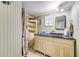 Bathroom boasts modern vanity with black countertop and decorative accents on the open shelving at 1710 7Th Sw St # 95, Ruskin, FL 33570