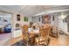 Dining area featuring brick accent wall, wooden furniture, and decorative wall art at 1710 7Th Sw St # 95, Ruskin, FL 33570