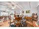 Open dining area with bar and kitchen featuring wooden furniture and bright windows at 1710 7Th Sw St # 95, Ruskin, FL 33570
