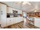 Well-lit kitchen with white cabinetry, stainless appliances, stylish backsplash, and ample countertop space at 1710 7Th Sw St # 95, Ruskin, FL 33570