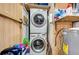 Convenient laundry area featuring a stacked washer and dryer at 1710 7Th Sw St # 95, Ruskin, FL 33570
