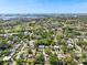Expansive aerial view of a neighborhood with golf course, water views, and lush landscaping at 1808 Gray S St, Gulfport, FL 33707