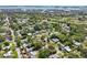 Panoramic aerial shot of a vibrant community, highlighting lush greenery, residential streets, and a coastal backdrop at 1808 Gray S St, Gulfport, FL 33707