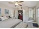 Comfortable main bedroom features a ceiling fan, neutral walls, light-colored wood floors and a closet at 1808 Gray S St, Gulfport, FL 33707