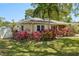 Charming single-story home featuring lush landscaping and beautiful foliage at 1808 Gray S St, Gulfport, FL 33707