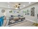 Cozy living room featuring hardwood floors, large windows, and stylish furniture at 1808 Gray S St, Gulfport, FL 33707