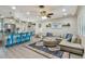 Bright living room with a large sectional couch, open floorplan, and views of the kitchen at 1808 Gray S St, Gulfport, FL 33707