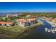 Aerial view showcases the community's waterfront location, marina, and manicured grounds at 1810 Mariner Dr # 207, Tarpon Springs, FL 34689