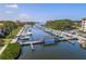 Beautiful aerial view of the community marina with docks, waterways, and lush landscaping at 1810 Mariner Dr # 207, Tarpon Springs, FL 34689