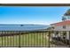 Water view from the balcony with lush landscaping and manicured lawn at 1810 Mariner Dr # 207, Tarpon Springs, FL 34689