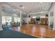 Large clubhouse featuring hardwood floors, ceiling fans, and comfortable seating areas for gatherings at 1810 Mariner Dr # 207, Tarpon Springs, FL 34689