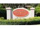 Attractive community sign for Mariner Village Tarpon Cove surrounded by lush landscaping at 1810 Mariner Dr # 207, Tarpon Springs, FL 34689